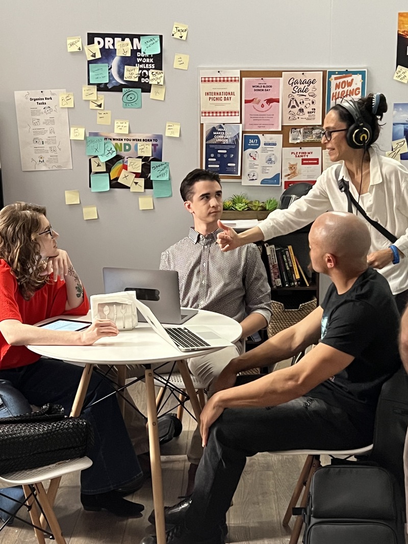 Director Ana Clavell discusses the scene with actors Nicole Unger (Lena), Jeremiah Brannan (Glenn), and Jonathon James (Denny) .