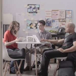 Writers Lena (Nicole Unger), Glenn (Jeremiah Brannan), and Denny (Jonathon James) work on their plot.