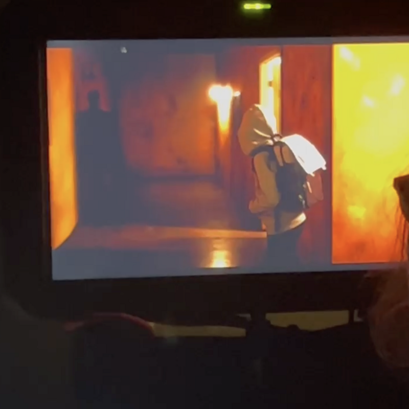 Director Ana Clavell watches actors Phoenix Lamorae and Antonio Granda Manzano on her monitor.